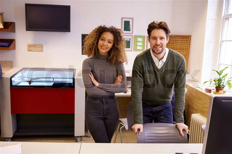 Portrait Of Designers With CAD System For Laser Cutter, stock photo