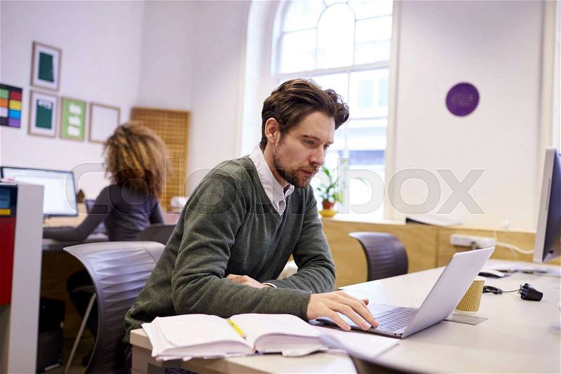 Staff In Design Office With CAD System For Laser Cutter, stock photo