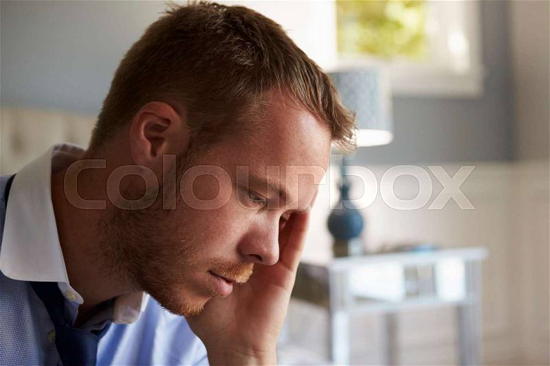 Stressed Businessman Getting Dressed For Work, stock photo