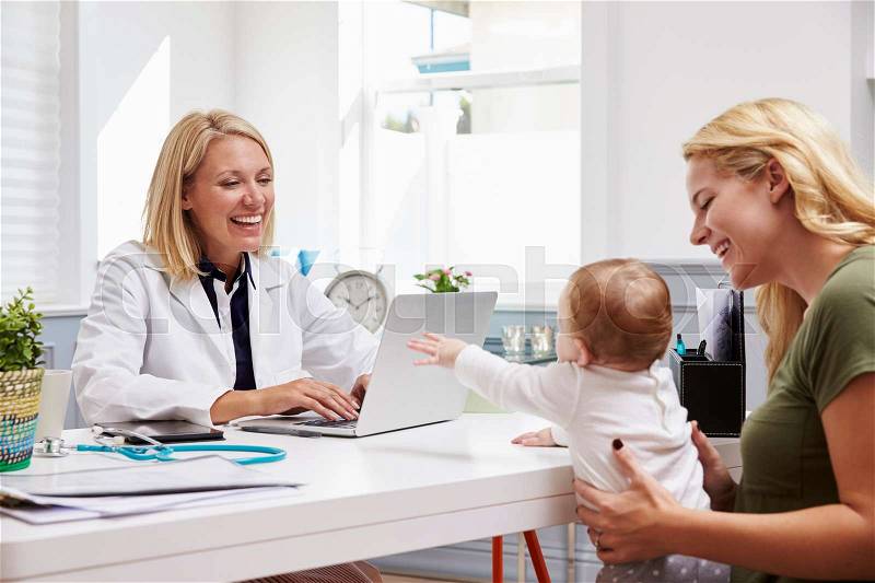 Mother And Baby Meeting With Female Doctor In Office, stock photo