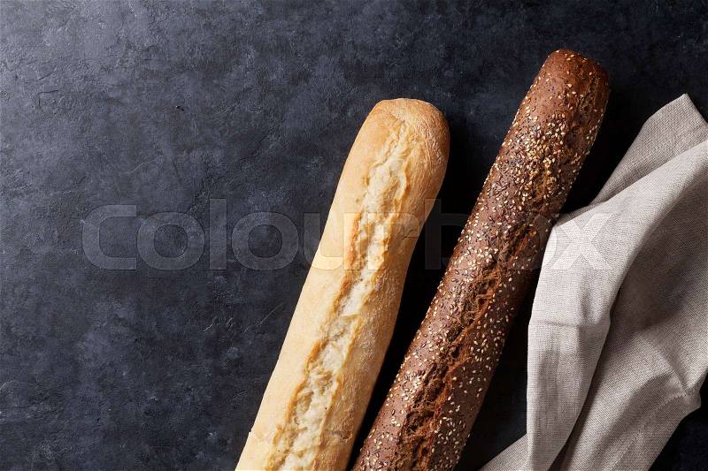 Mixed breads on stone table. Top view with copy space, stock photo