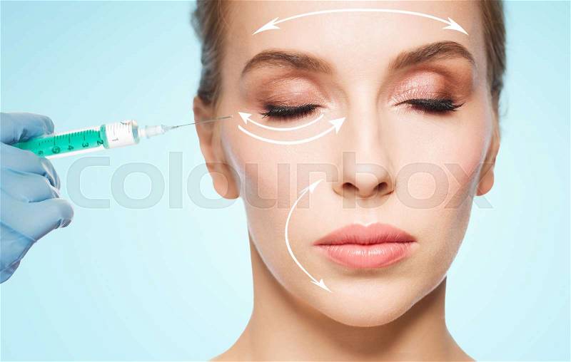 People, cosmetology, plastic surgery and beauty concept - beautiful young woman face and beautician hand in glove with syringe making injection over blue background, stock photo
