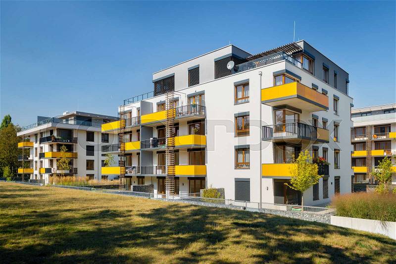Modern block of flats with yellow balconies, stock photo