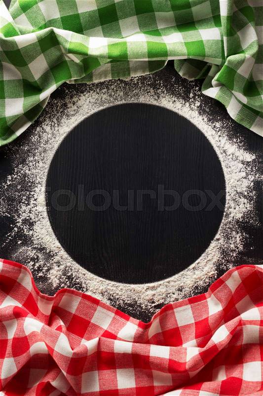Wheat flour and cloth napkin on wooden background, stock photo