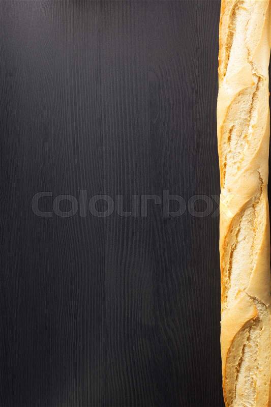 French bread on wooden background, stock photo