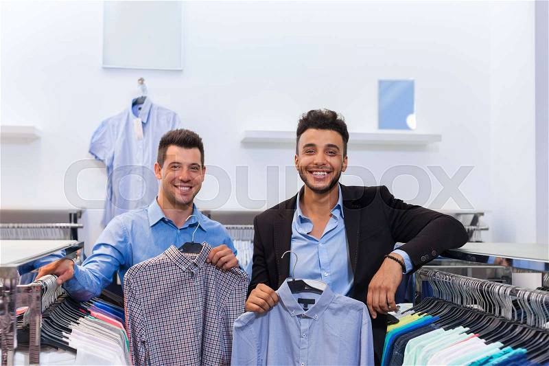 Two Handsome Business Man Fashion Shop, Happy Smiling Mix Race Friends Customers Choosing Clothes Shirts In Retail Store Young People Shopping Formal Wear, stock photo