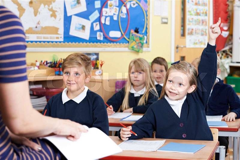 Class Of Elementary School Pupils Answering Question, stock photo
