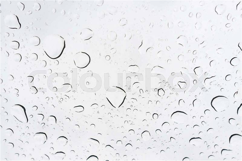 Drops of rain on glass, rain drops on clear window, stock photo