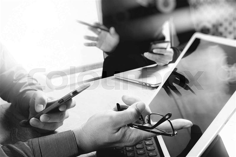Business team meeting present. Photo professional investor working with new startup project. Finance managers meeting.Digital tablet laptop computer design smart phone using.black white , stock photo