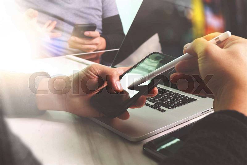 Business team meeting present. Photo professional investor working with new startup project. Finance managers meeting.Digital tablet laptop computer design smart phone using.Sun flare effect , stock photo