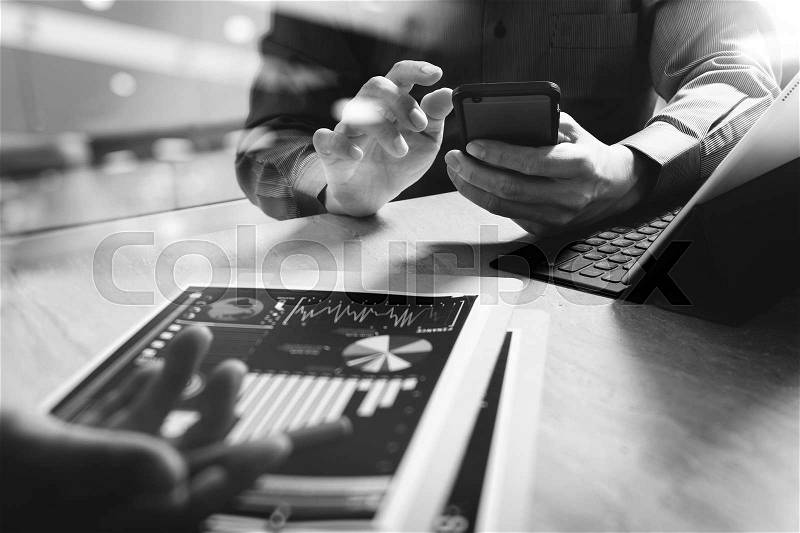 Business team meeting present. professional investor working new startup project. Finance managers meeting.Digital tablet keyboard docking screen computer design smart phone using, sun effect.black white, stock photo