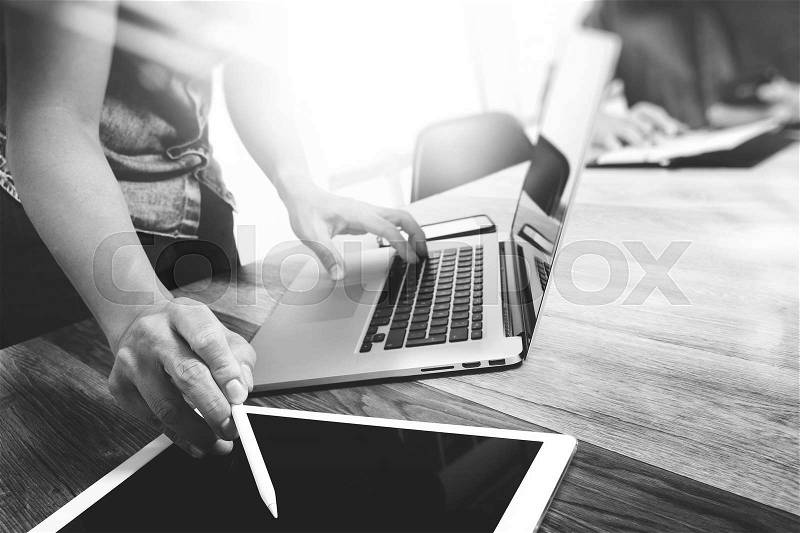 Business team meeting present. Photo professional investor working with new startup project. Finance managers meeting.Digital tablet laptop computer design smart phone using. Blurred background, Sun flare effect,Horizontal, stock photo
