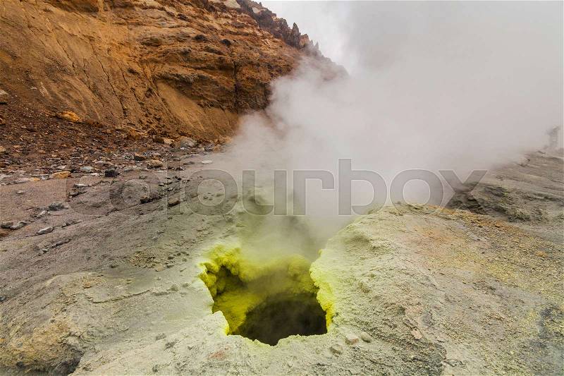 Yellow fumaroles and volcanic rocks. Kamchatka Peninsula, stock photo