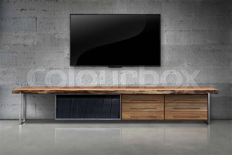 Led tv on color concrete wall with wooden table living room interior vintage style, stock photo
