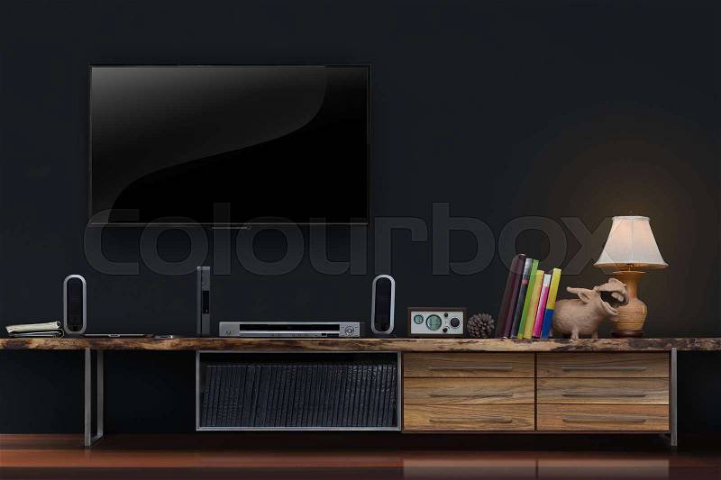 Living room led tv on concrete wall with wooden table media furniture modern loft style, stock photo