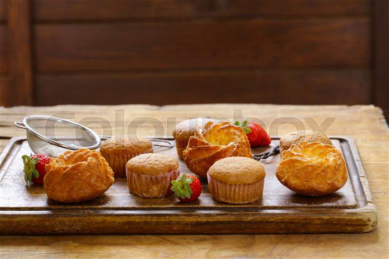 Homemade pastries, sweet muffins with powdered sugar, stock photo