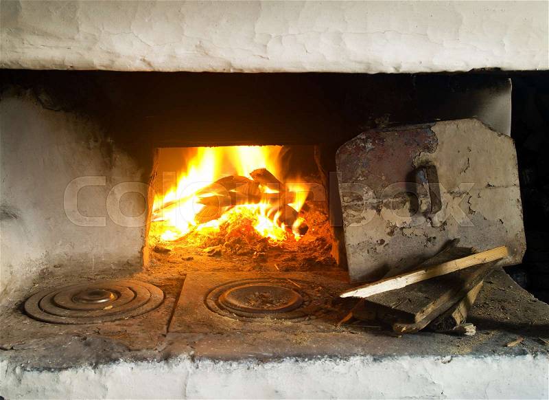 Fire in fireplace. Closeup of firewood burning in fire, stock photo