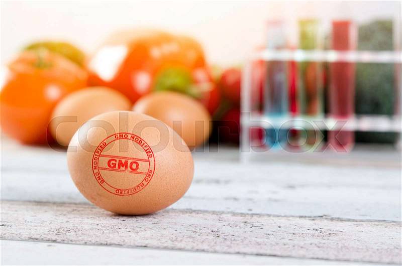 Close up of egg with GMO modified stamp. Genetically modified food conception, stock photo