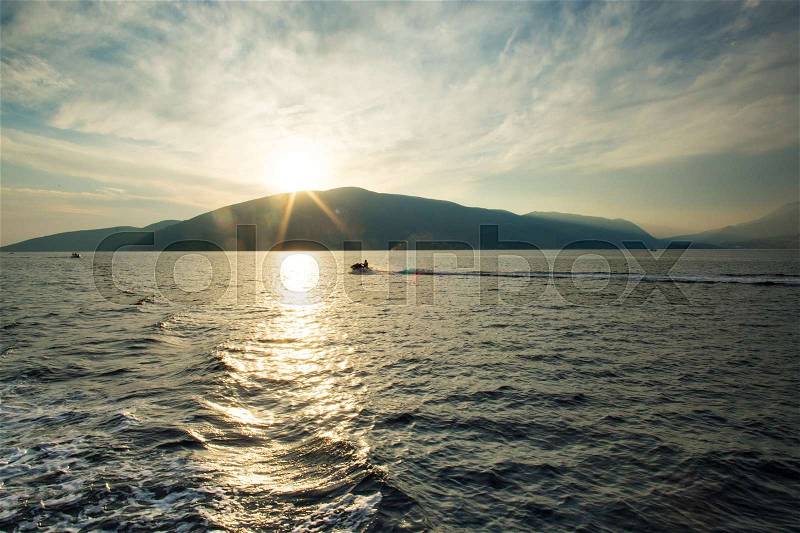 Beautiful sea landscape with water bike wich running throgh a Kotor bay, stock photo
