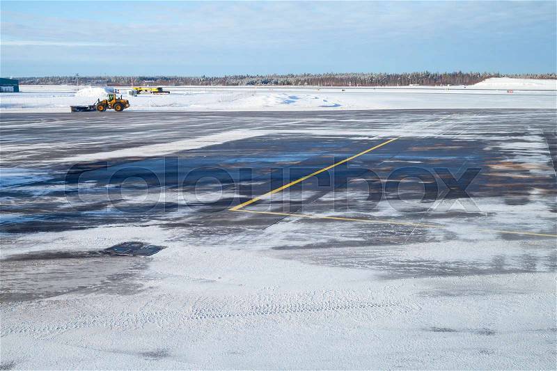 Snowy empty runway field. Turku airport in winter, Finland, stock photo