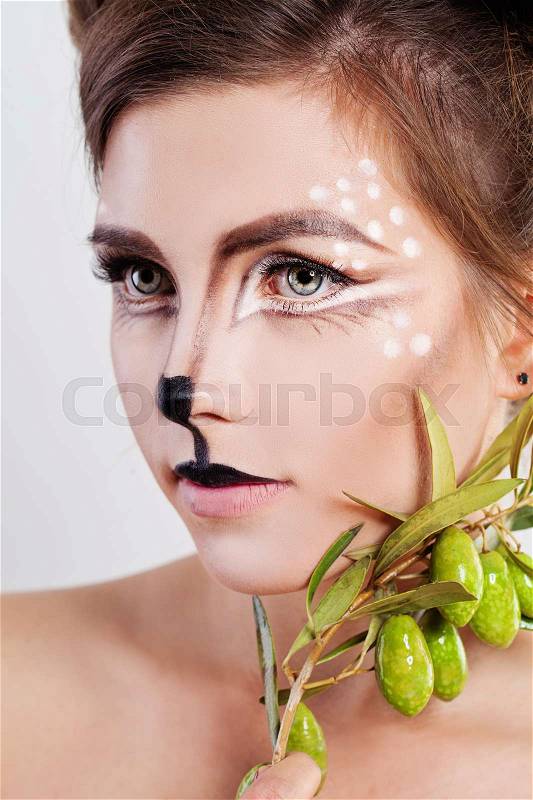 Young Woman Deer Animal. Face with Artistic Make-up, stock photo