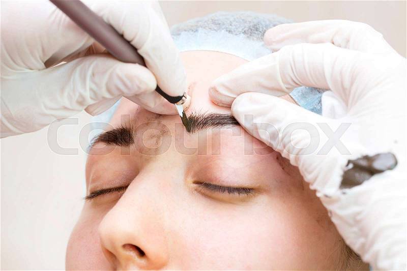Mikrobleyding eyebrows workflow in a beauty salon Mikrobleyding eyebrows workflow in a beauty salon, stock photo
