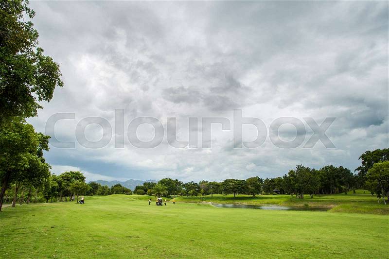 Golf course with player, stock photo