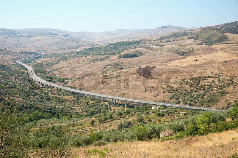Inland landscape of inner Sicily with motorway in summer day, Sicily island, stock photo