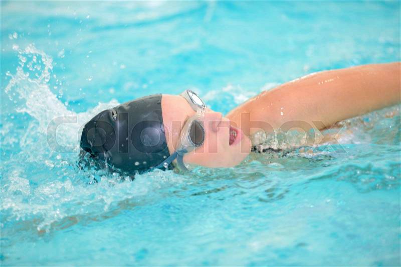 Female swimmer doing front crawl, stock photo