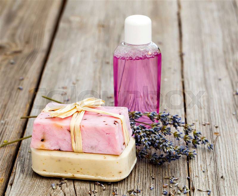 Lavender handmade soap bars, on wooden background, stock photo