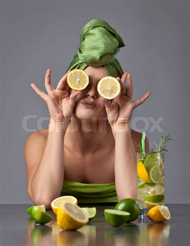 beautiful woman in green turban with lemon, stock photo
