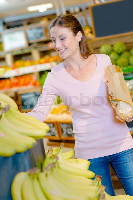 Consumer buying fruit, stock photo