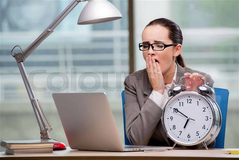 Businesswoman failing to meet challenging deadlines, stock photo