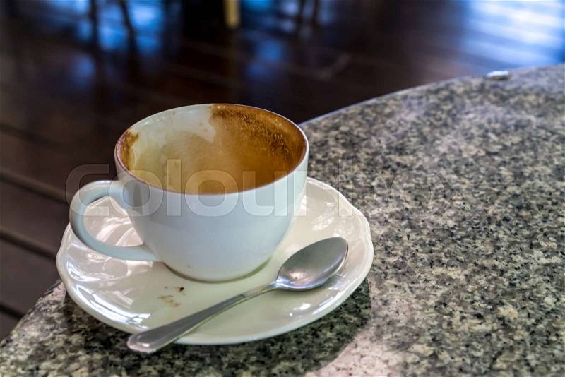 Empty white ceramic coffee\'s cup on granite table, stock photo