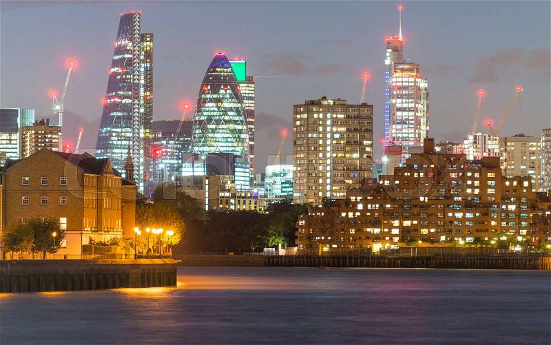 LONDON - SEPTEMBER 26, 2016: Skyline of London City business district. London attracts 30 million people annually, stock photo