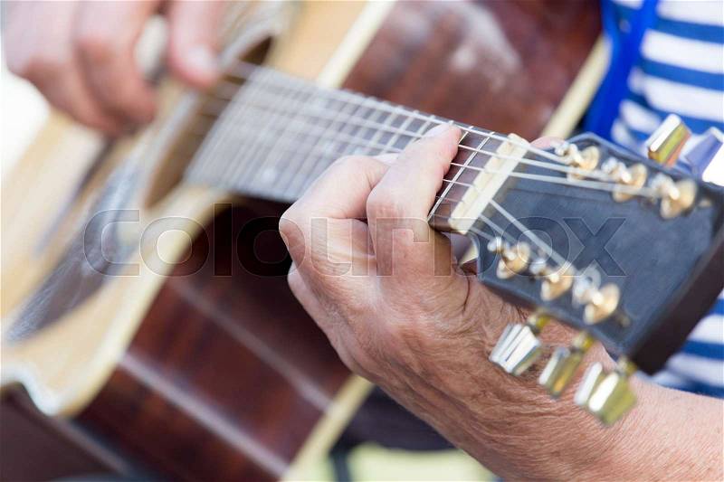 Hand man playing the guitar, stock photo