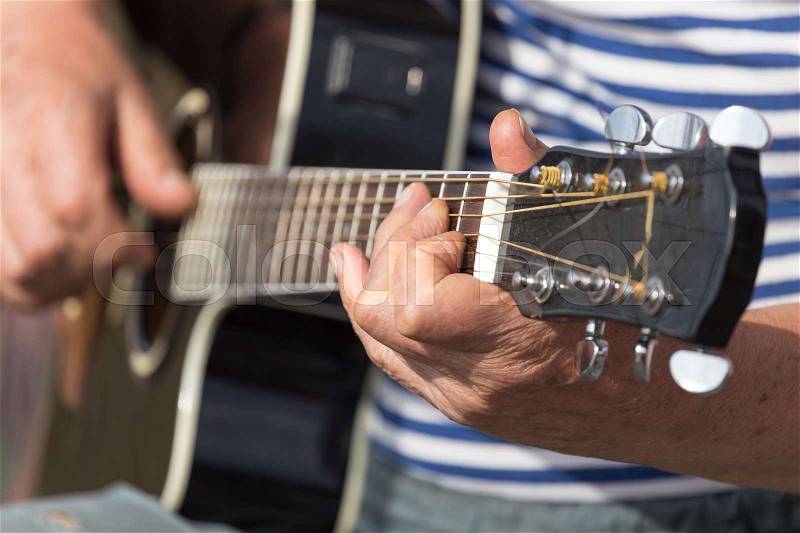 Hand man playing the guitar, stock photo