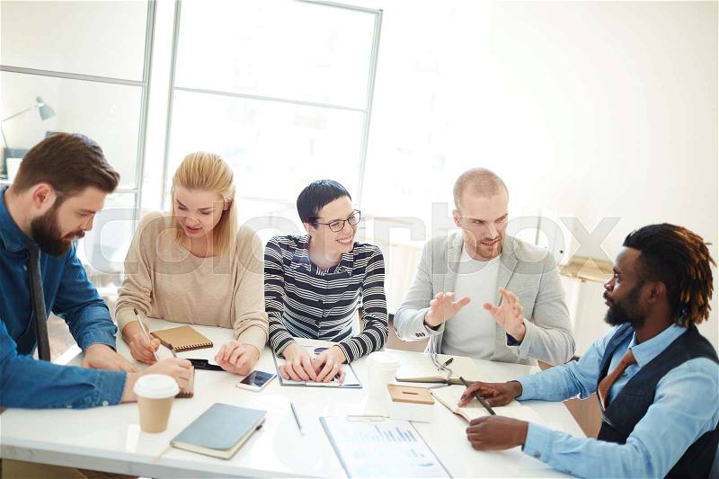 Business team talking about new principles in business, stock photo