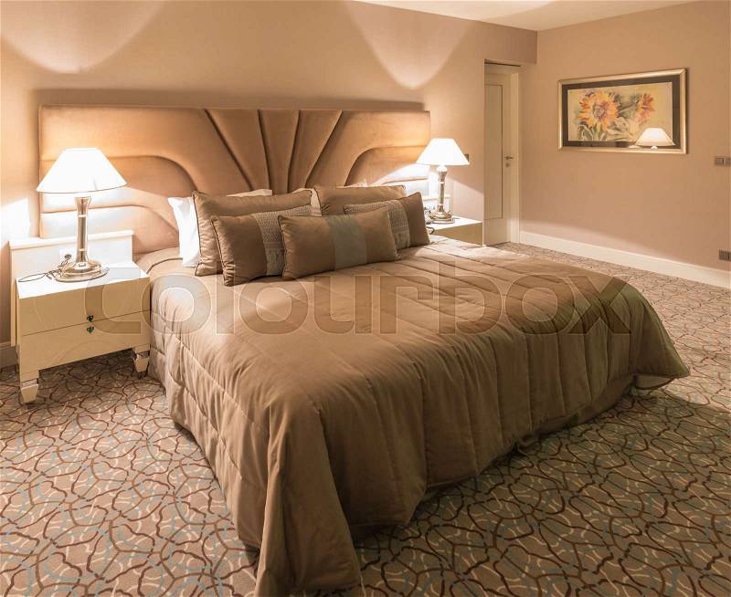 Modern hotel room with big bed, stock photo