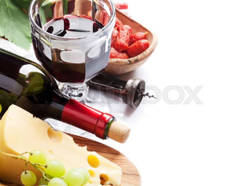 Red wine, grape, cheese, bread and sausages. Isolated on white background with copy space, stock photo