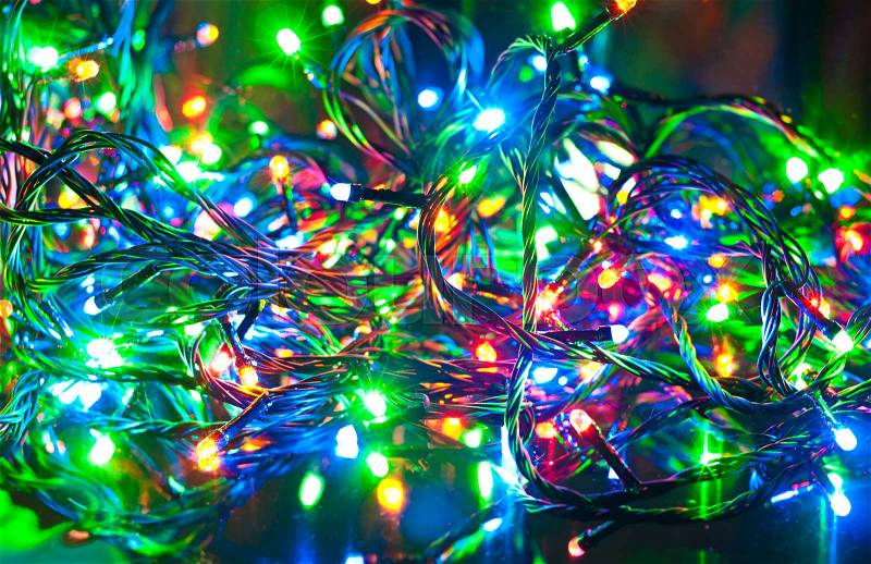 Electric garland. Abstract Christmas background, green, red, yellow and blue colors, stock photo