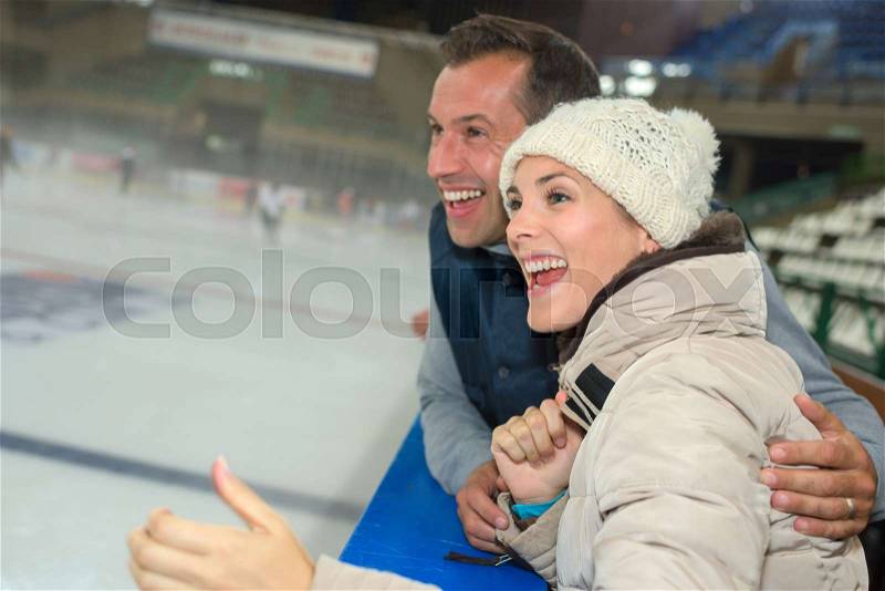 Couple supporting ice hockey team, stock photo