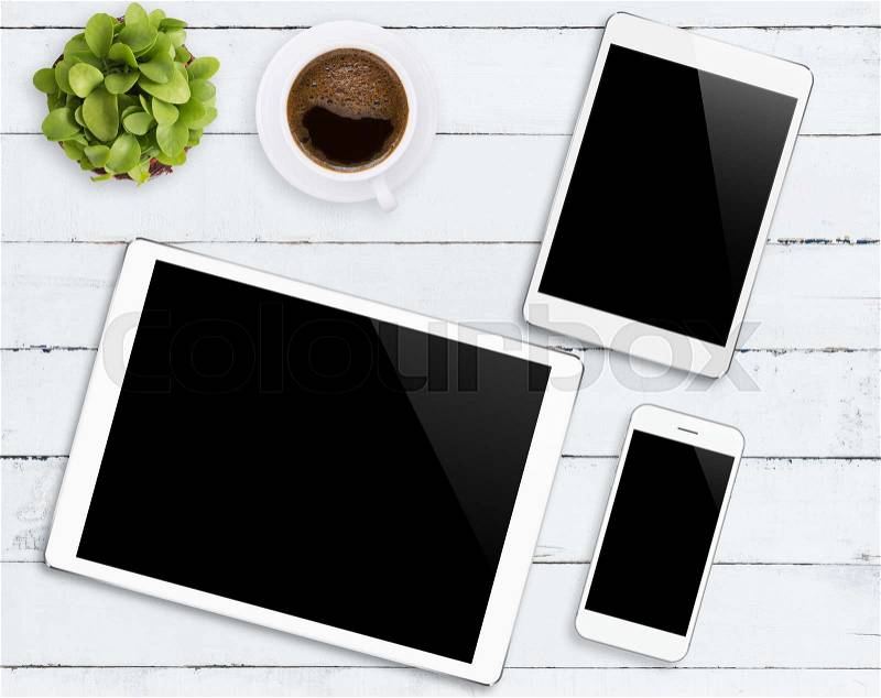 Communicator device phone and tablet white color tone on wood table, mockup modern phone and digital tablet, stock photo
