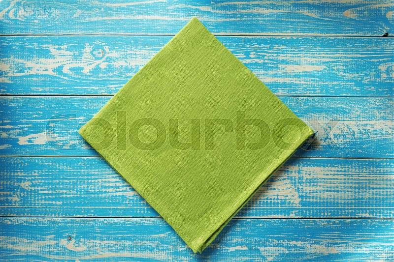 Cloth napkin on rustic wooden background, stock photo