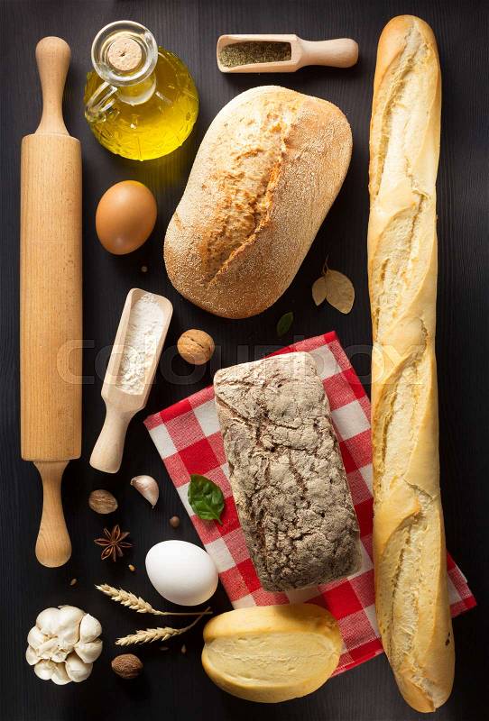 Bread and bakery products on wooden background, stock photo