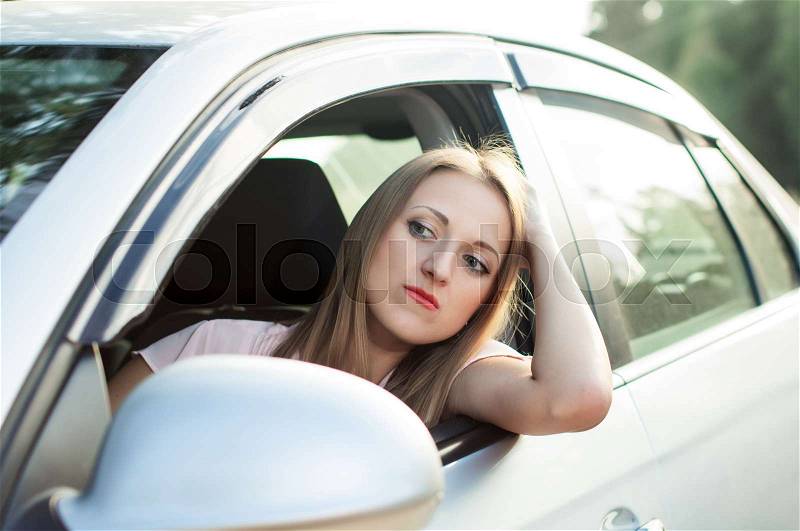 Sadness, the driver of the girl got stuck in traffic, stock photo