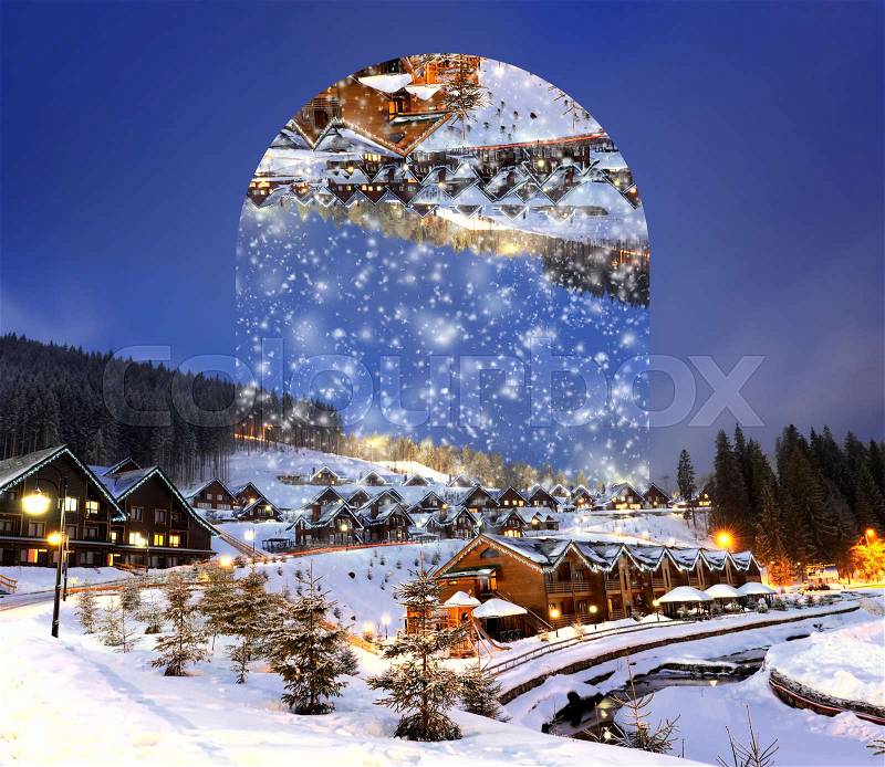 Houses decorated and lighted for christmas at night. Geometric reflections effect, stock photo