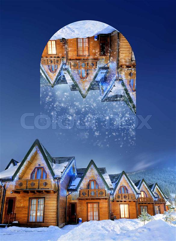 Houses decorated and lighted for christmas at night. Geometric reflections effect, stock photo