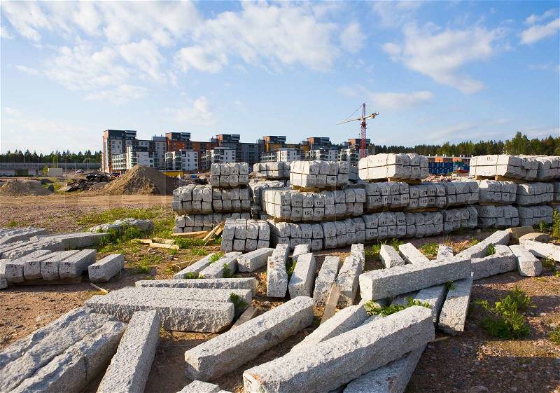 Stacks of street stones brought to a new suburb area yet under construction, stock photo