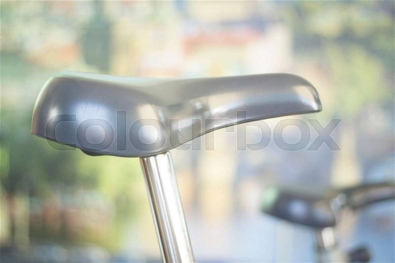 Gym bike exercise cycle machine for static indoor cycling in fitness studio, stock photo
